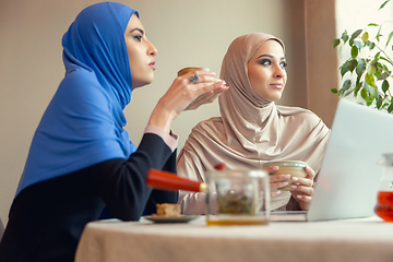 Image showing Beautiful arab women meeting at cafe or restaurant, friends or business meeting