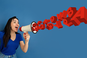 Image showing Woman shouting with megaphone, loudspeaker on studio background. Sales, offer, business, cheering fun concept.