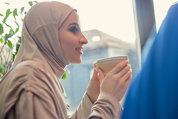 Image showing Beautiful arab women meeting at cafe or restaurant, friends or business meeting