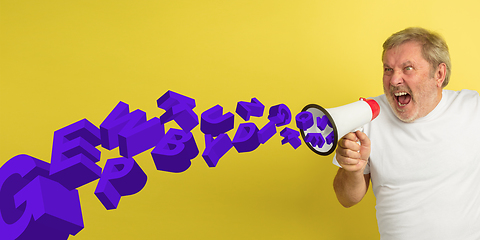 Image showing Man shouting with megaphone, loudspeaker on studio background. Sales, offer, business, cheering fun concept.