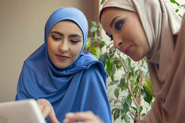 Image showing Beautiful arab women meeting at cafe or restaurant, friends or business meeting