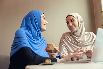 Image showing Beautiful arab women meeting at cafe or restaurant, friends or business meeting