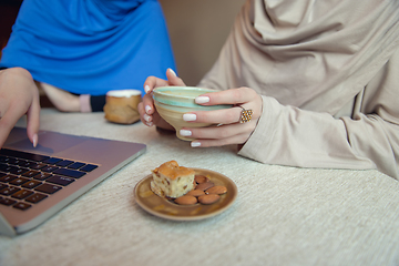 Image showing Beautiful arab women meeting at cafe or restaurant, friends or business meeting