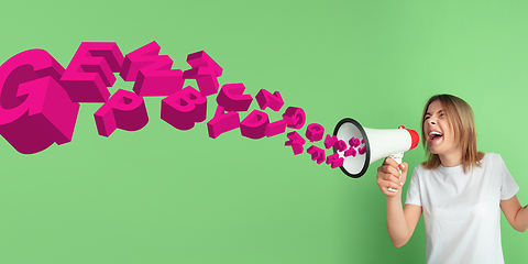 Image showing Woman shouting with megaphone, loudspeaker on studio background. Sales, offer, business, cheering fun concept.