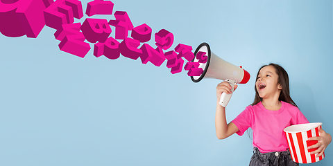 Image showing Girl shouting with megaphone, loudspeaker on studio background. Sales, offer, business, cheering fun concept.