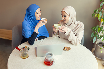 Image showing Beautiful arab women meeting at cafe or restaurant, friends or business meeting