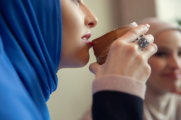 Image showing Beautiful arab women meeting at cafe or restaurant, friends or business meeting