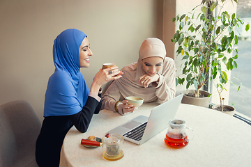 Image showing Beautiful arab women meeting at cafe or restaurant, friends or business meeting