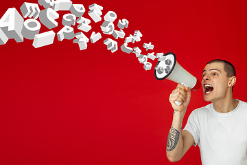 Image showing Man shouting with megaphone, loudspeaker on studio background. Sales, offer, business, cheering fun concept.