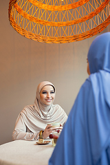 Image showing Beautiful arab women meeting at cafe or restaurant, friends or business meeting