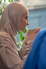 Image showing Beautiful arab women meeting at cafe or restaurant, friends or business meeting