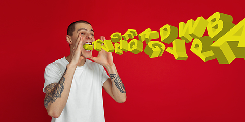 Image showing Man shouting, screaming on studio background. Sales, offer, business, cheering fun concept.