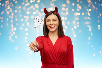 Image showing happy woman in red halloween costume of devil