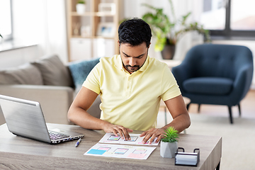 Image showing ui designer working on user interface at home