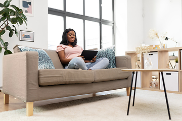 Image showing african american woman with tablet pc at home