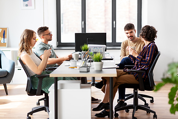 Image showing team of startuppers drinking coffee at office