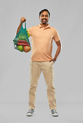 Image showing happy indian man with food in reusable net tote