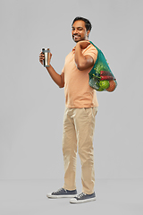 Image showing man with food in bag and tumbler or thermo cup