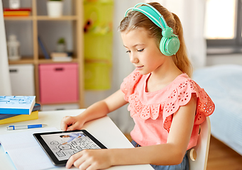 Image showing girl in headphones with tablet computer at home