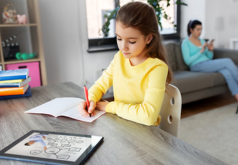 Image showing student girl with tablet pc learning at home