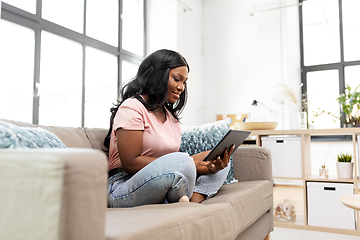 Image showing african american woman with tablet pc at home