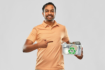 Image showing smiling young indian man sorting metallic waste