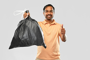 Image showing happy indian man with trash bag showing thumbs up