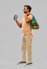 Image showing man with food in bag and tumbler or thermo cup