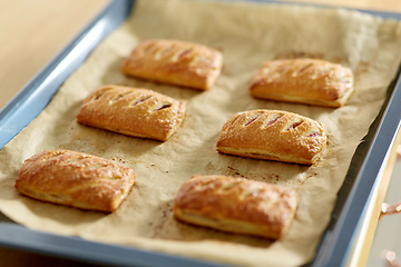 Image showing baking tray with jam pies at home kitchen