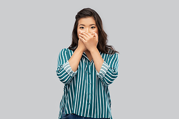 Image showing scared asian woman over grey background