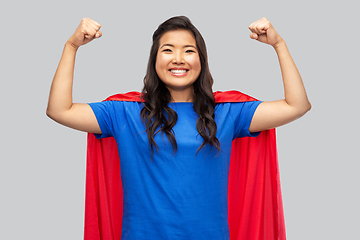 Image showing happy asian woman in red superhero cape