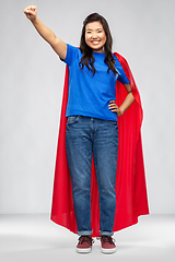 Image showing happy asian woman in red superhero cape