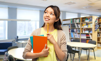 Image showing asian student woman with books at library