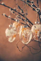 Image showing Holidays and Easter concept - close up of pussy willow branches decorated with Easter eggs