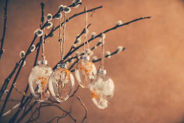 Image showing Holidays and Easter concept - close up of pussy willow branches decorated with Easter eggs