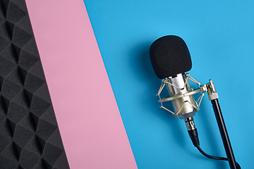 Image showing Microphone and acoustic foam panel, ober pink and blue background