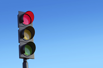 Image showing Red traffic light against sky