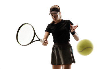 Image showing Young caucasian professional sportswoman playing tennis isolated on white background