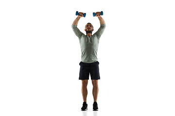 Image showing Young caucasian male model in action, motion isolated on white background. Concept of sport, movement, energy and dynamic, healthy lifestyle. Training, practicing.