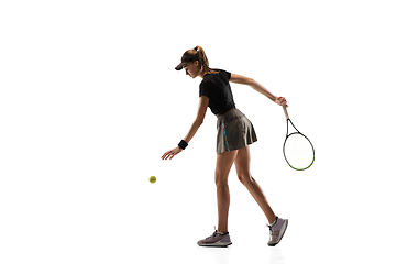 Image showing Young caucasian professional sportswoman playing tennis isolated on white background