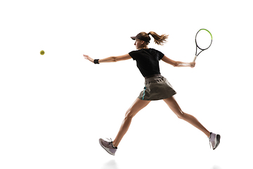 Image showing Young caucasian professional sportswoman playing tennis isolated on white background