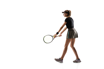 Image showing Young caucasian professional sportswoman playing tennis isolated on white background