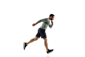 Image showing Young caucasian male model in action, motion isolated on white background. Concept of sport, movement, energy and dynamic, healthy lifestyle. Training, practicing.