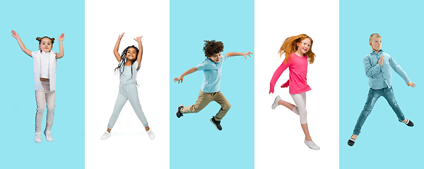 Image showing Group of elementary school kids or pupils jumping in colorful casual clothes on bicolored studio background. Creative collage.