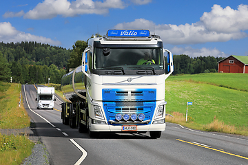 Image showing Blue White Volvo Milk Tanker on Road