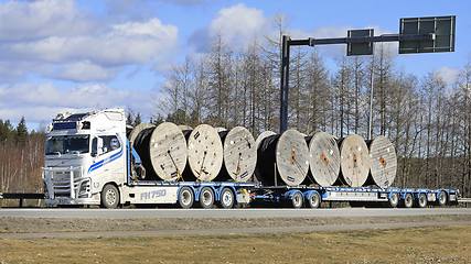 Image showing Volvo FH Truck Transports Cable Reels on Flatbed Trailer