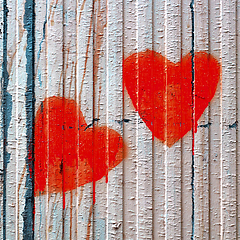 Image showing Red Valentine loving hearts on an old wooden fence