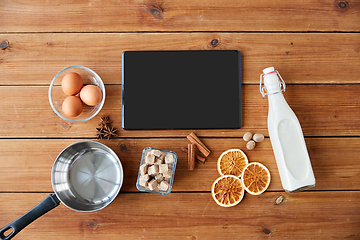 Image showing tablet pc, ingredients for eggnog cooking