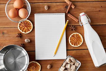 Image showing notebook, pencil, ingredients for eggnog cooking