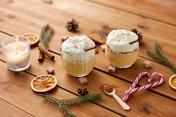 Image showing glasses of eggnog with whipped cream and spices